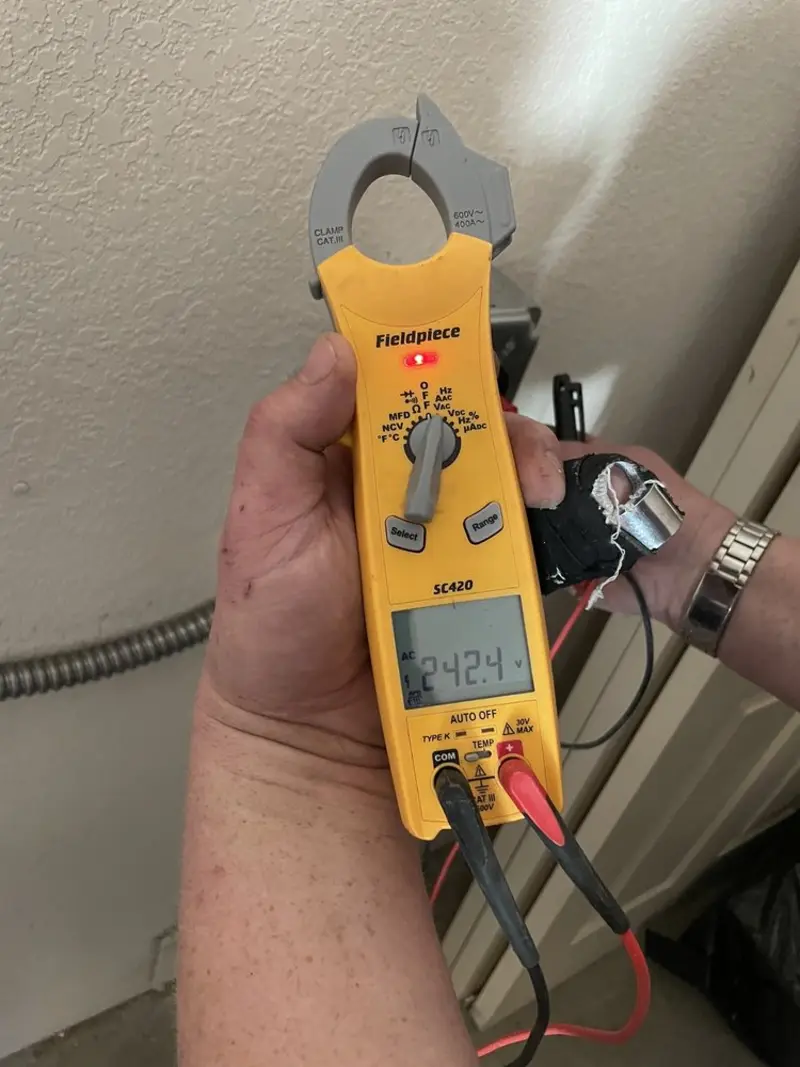 Voltage testing with clamp meter during Outlet Installation in Duncan